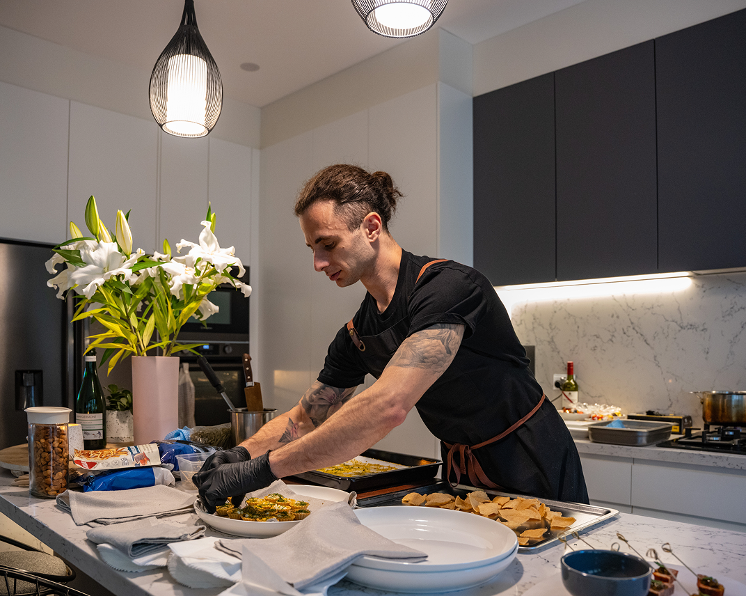 Chef Vinnie in modern Naremburn kitchen preparing canapé catering
