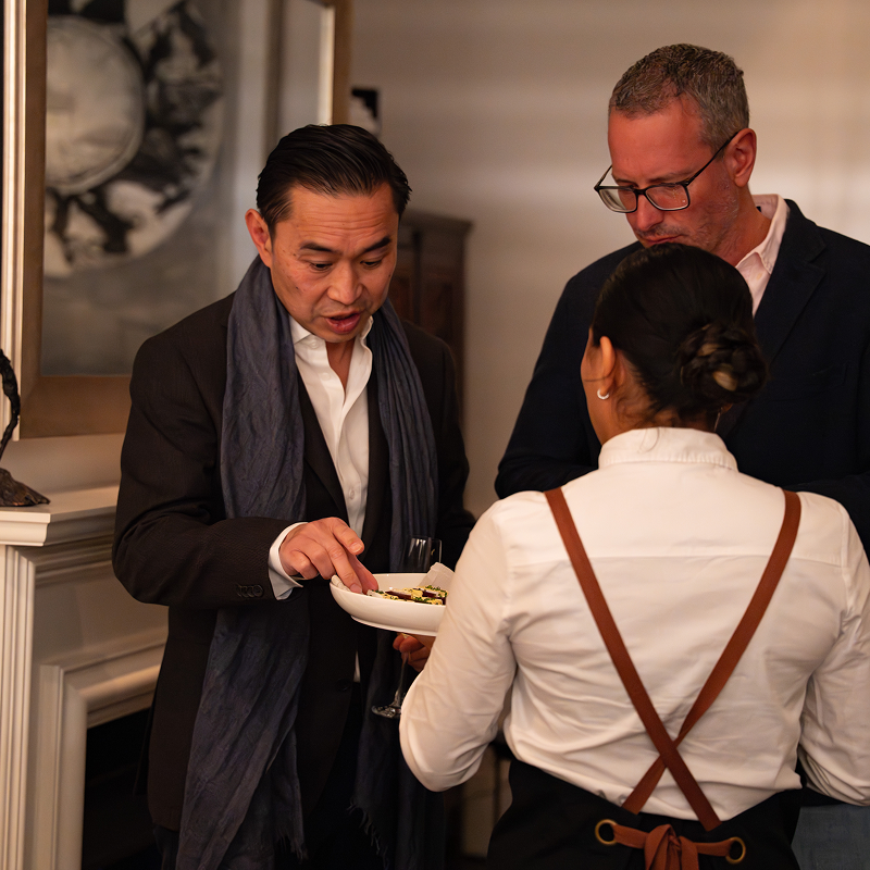 Birthday party catering Sydney guests in Bondi home reacting to creative canapés