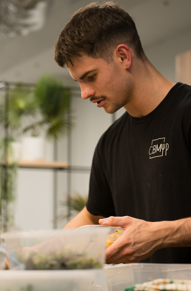 Close-up of Chef Matt focused on corporate catering prep