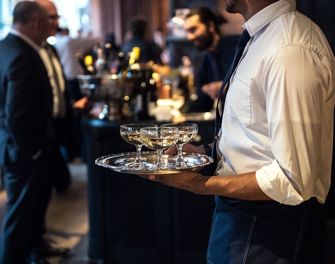 Wine glasses on platter served by waiter at Edgecliff private dining event