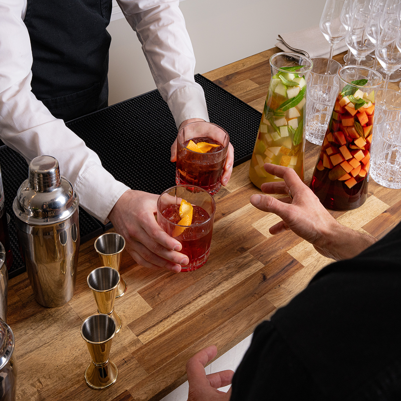 Barista serves cocktails at a wedding reception in Sydney