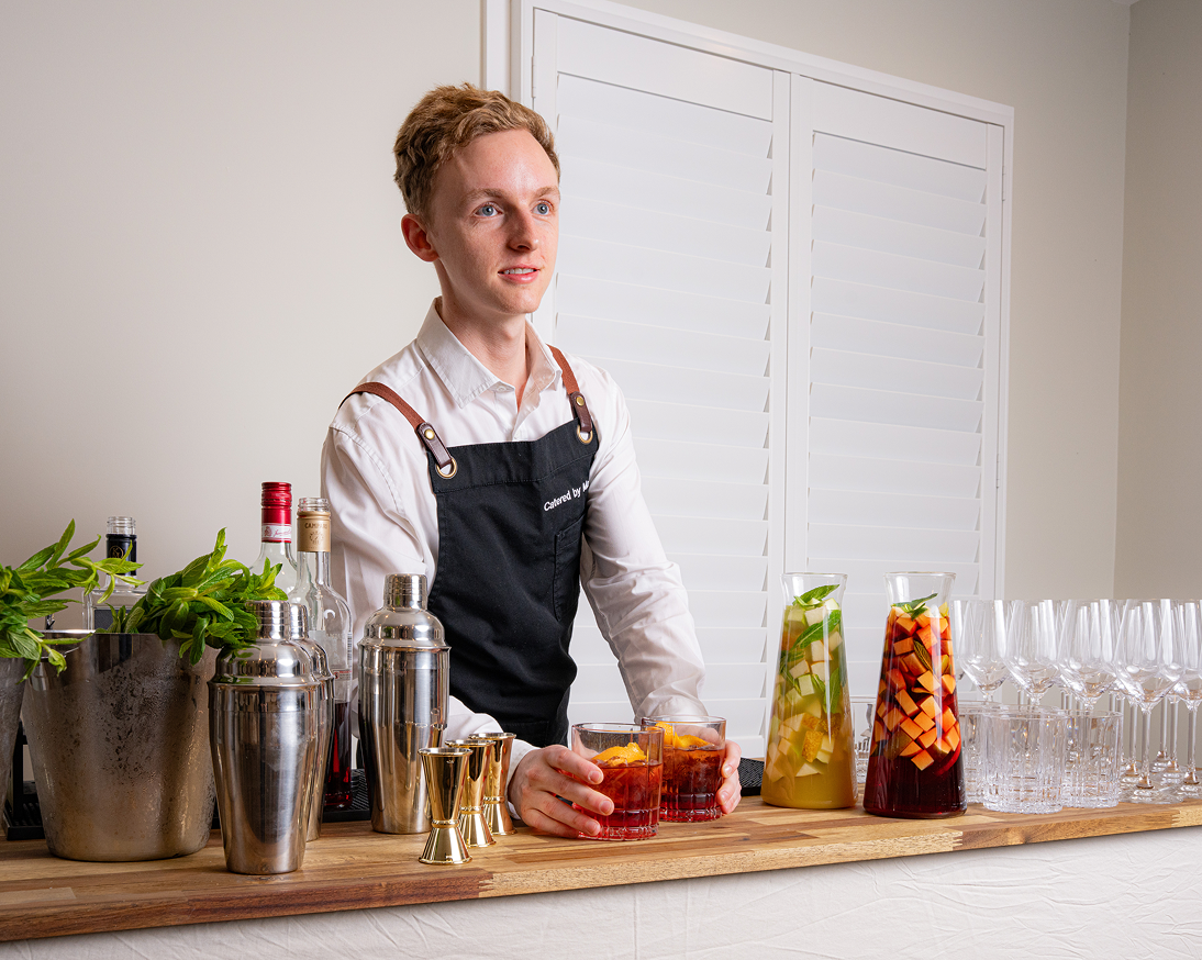 Waiter preparing cocktails for Willoughby catering event