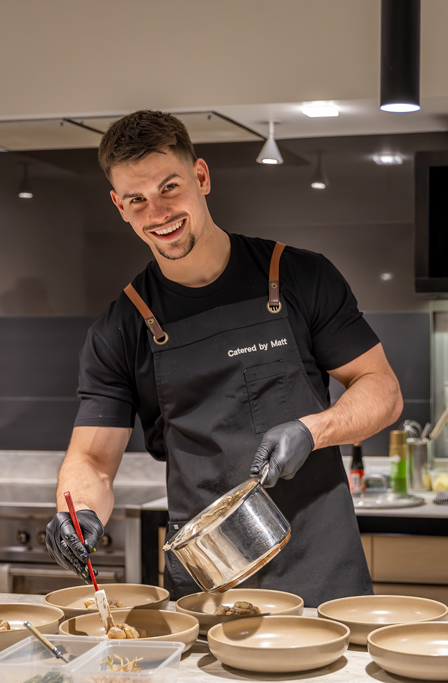 Chef Matt smiling in modern kitchen at Jordan Springs event