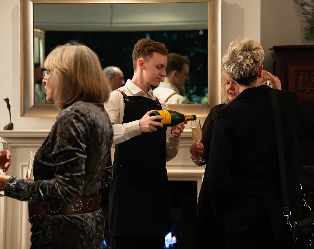 Waiter presenting French campagne in Barangaroo residence