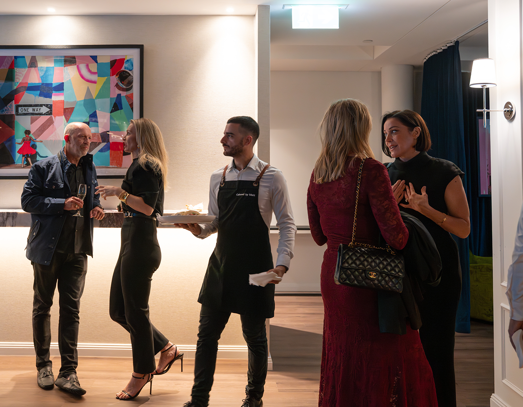 Waiter serving guests at Sydney birthday catering event