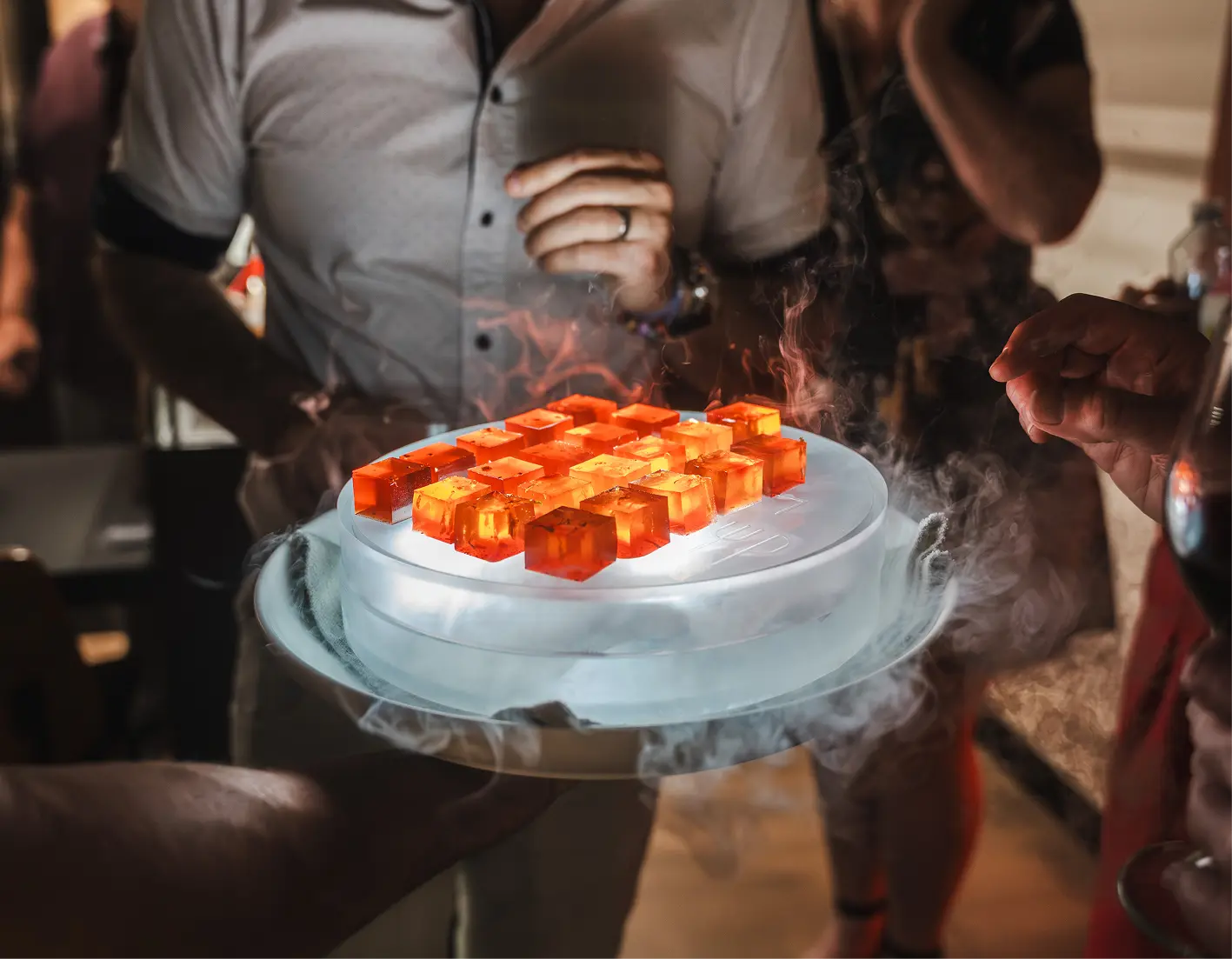 Cocktail jellies served on a dry ice platter as welcome drinks at a boardroom meeting
