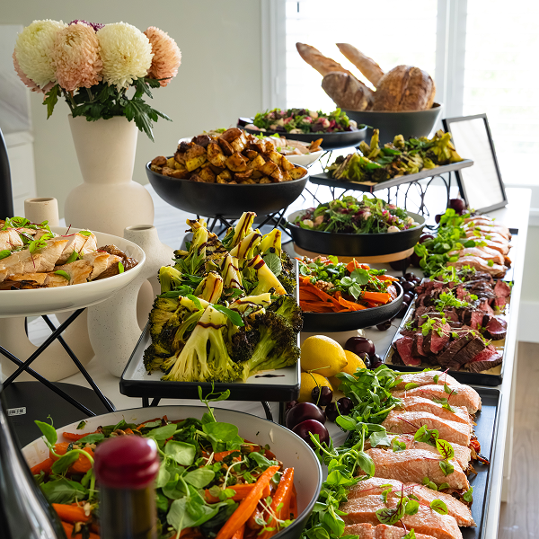 Generous buffet spread at a dinner party table in Sydney