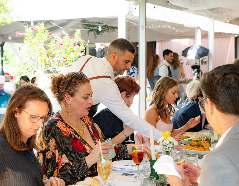 Corporate staff enjoying long table dining