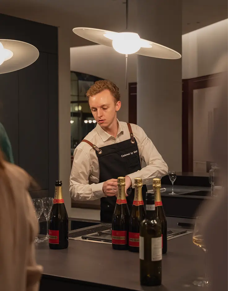 Catered by Matt staff setting up drinks service for a corporate event of 20 guests