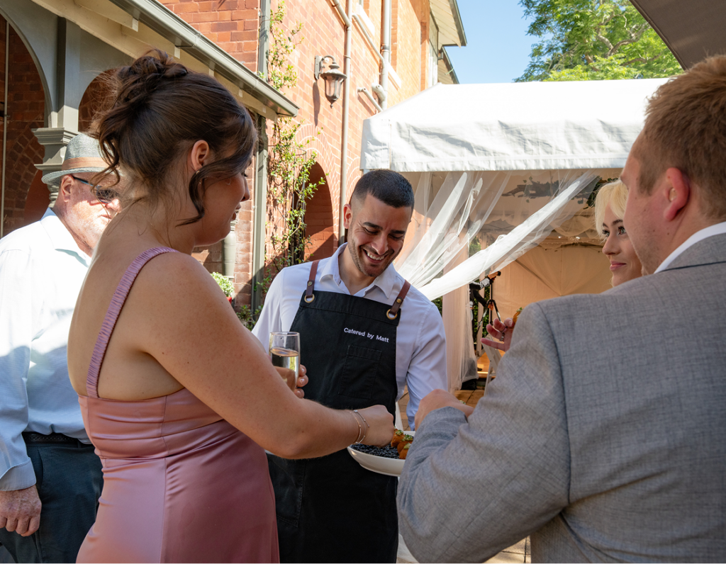 Waitstaff serving canapés at a Sydney wedding