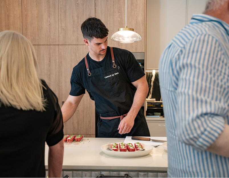Chef Matt plating colorful canapés at a Sydney wedding venue