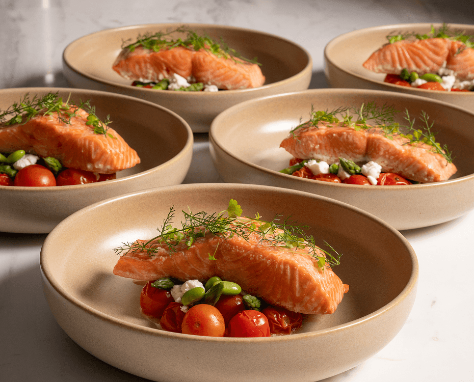 Corporate team building lunch featuring fresh salmon and seasonal produce