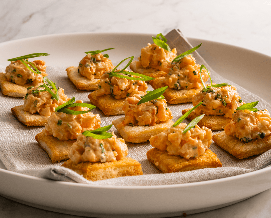 Event catering Sydney featuring prawn canapés on crisp crostini