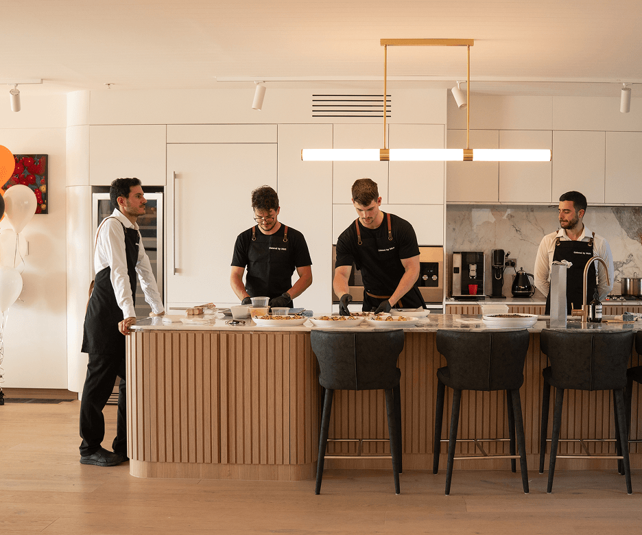 Party catering Sydney with chefs preparing food in a private residence