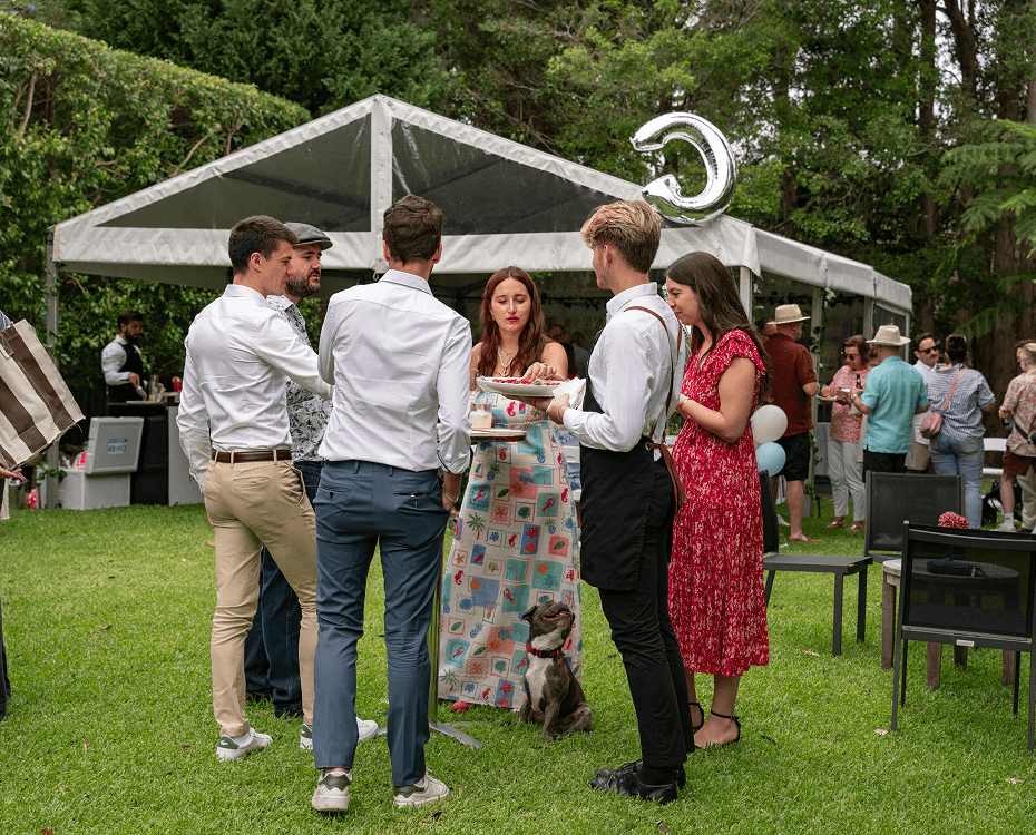 Sydney engagement party guests mingling at a catered outdoor event