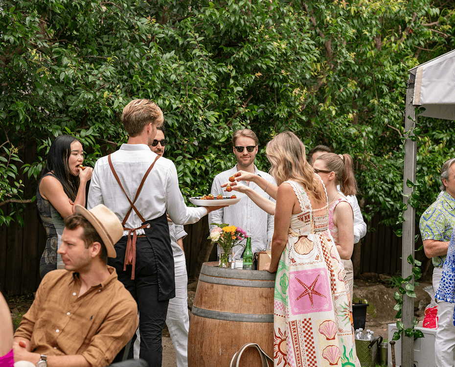 Wedding catering Sydney guests enjoying canapés at a garden reception