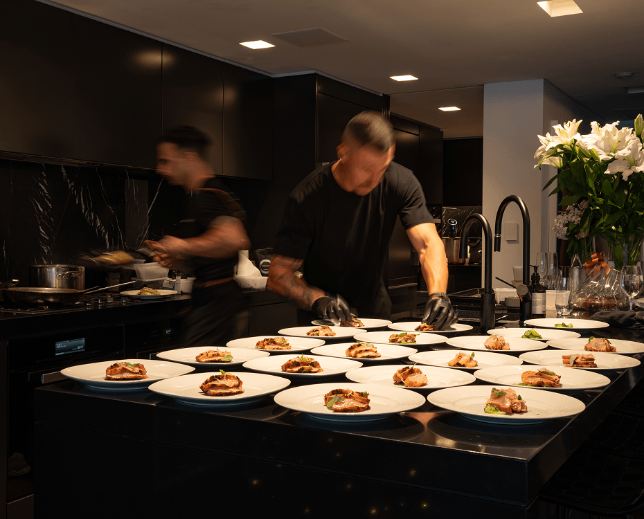 Catering Campbelltown chefs preparing plated meals for event guests