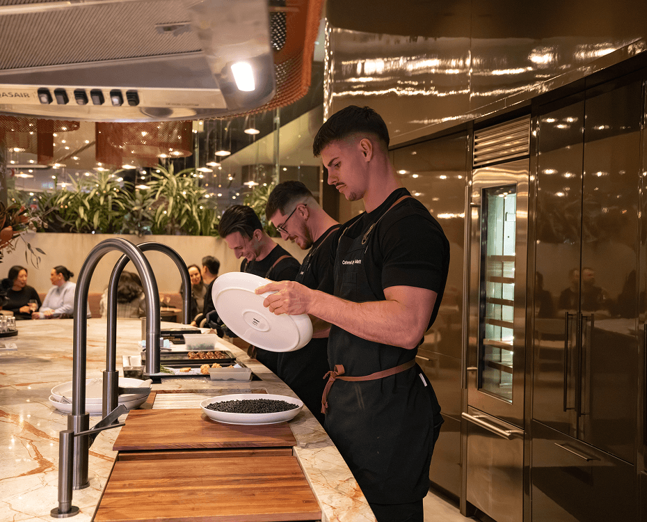 Catering Mosman chefs preparing fresh dishes in an open kitchen