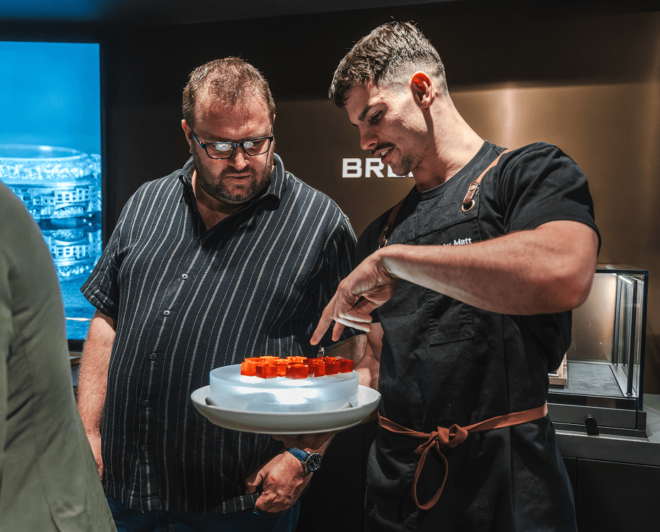 Catering North Shore staff presenting liquid nitrogen cocktail jellies to guests