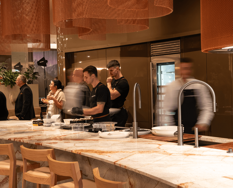North Sydney catering team preparing canapés while guests socialise