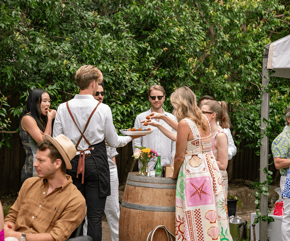 Intimate 40th birthday dinner with cake, wine glasses and guests