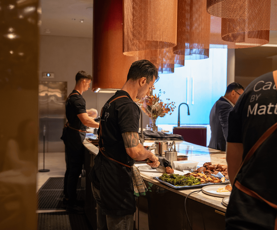 Office lunch catering Sydney chefs preparing a fresh buffet lunch for employees