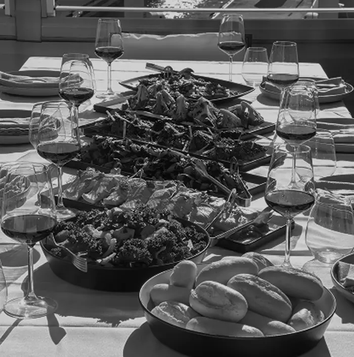 Lunch spread of salads and meats set on a long table for a Brookvale business lunch