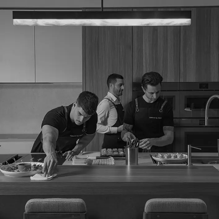 Private chefs plating dishes in a Freshwater home kitchen
