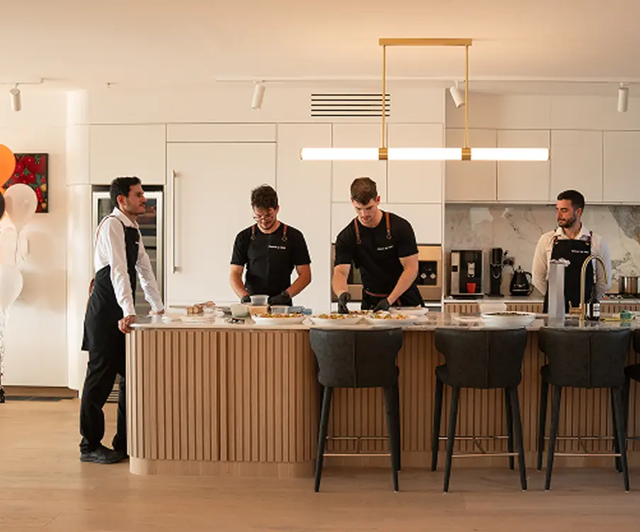 Catering team at work in an open kitchen for a Chatswood event