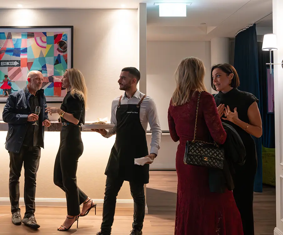 Waiter moving through guests with canapés at a Surry Hills event