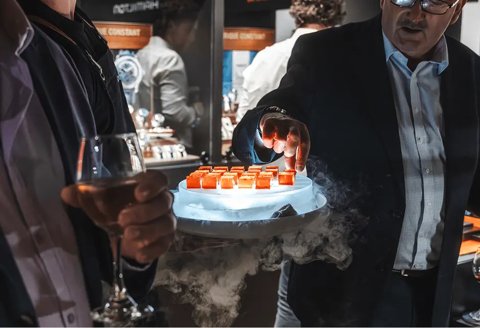 Guest taking a cocktail jelly from a smoking dry ice platter at a Western Sydney event