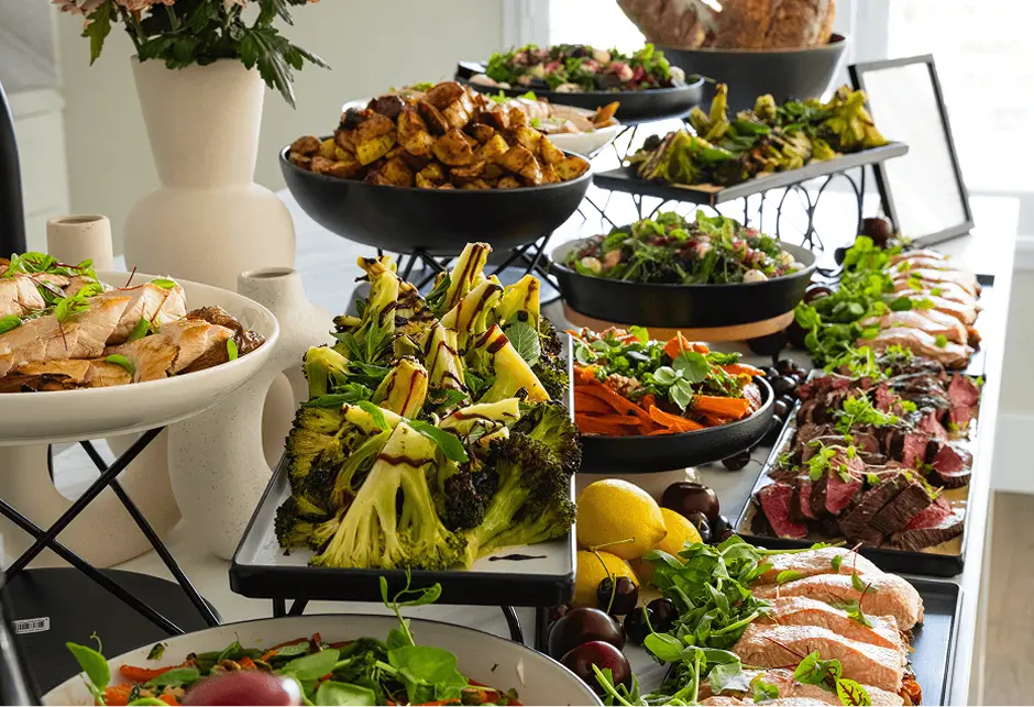 Buffet stands of meats, charred broccoli and salads for a Northern Beaches celebration