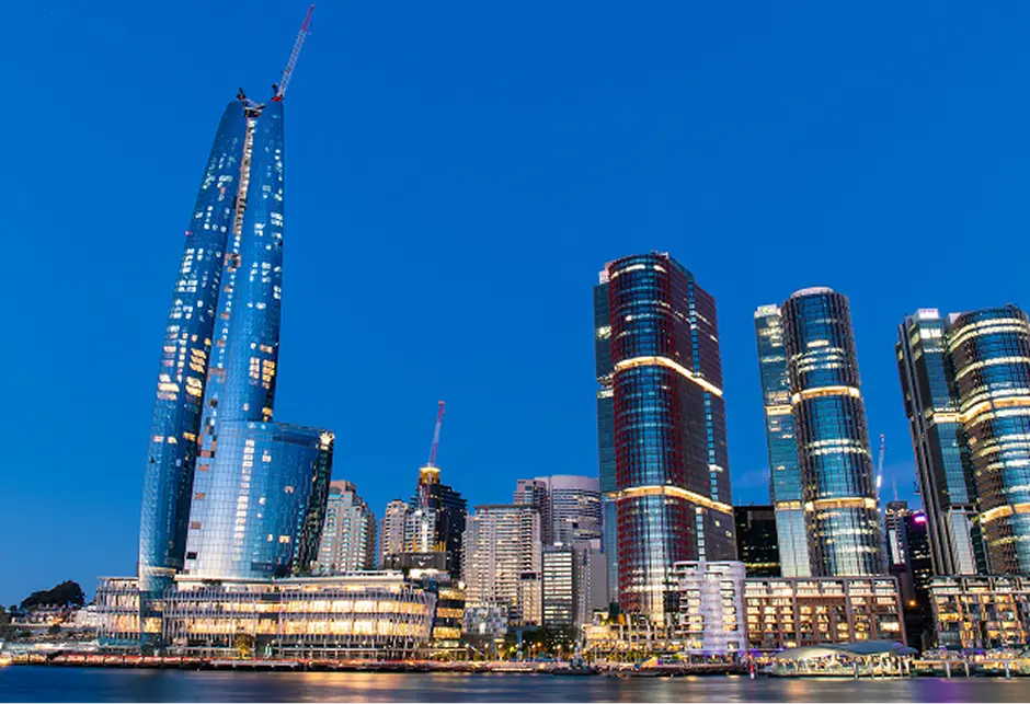 Sydney CBD towers and the waterfront lit up at night