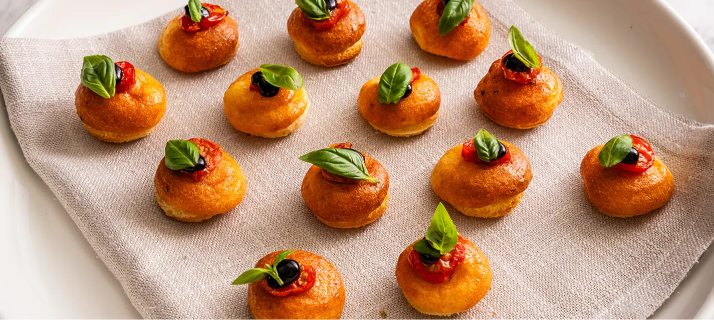 Tomato and basil canapés plated on linen for a Northern Beaches party