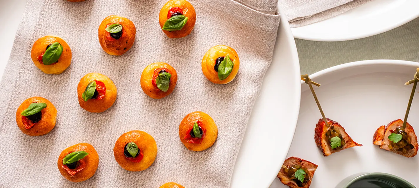 Basil topped tomato canapés and skewers plated for a Chatswood cocktail party