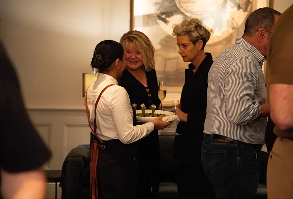 Waiter offering canapés to guests at an Eastern Suburbs celebration