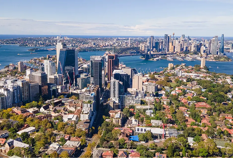 Aerial view of North Sydney towers with the harbour and city skyline behind