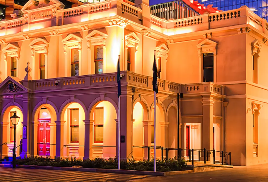 Heritage building lit up at night in the centre of Parramatta