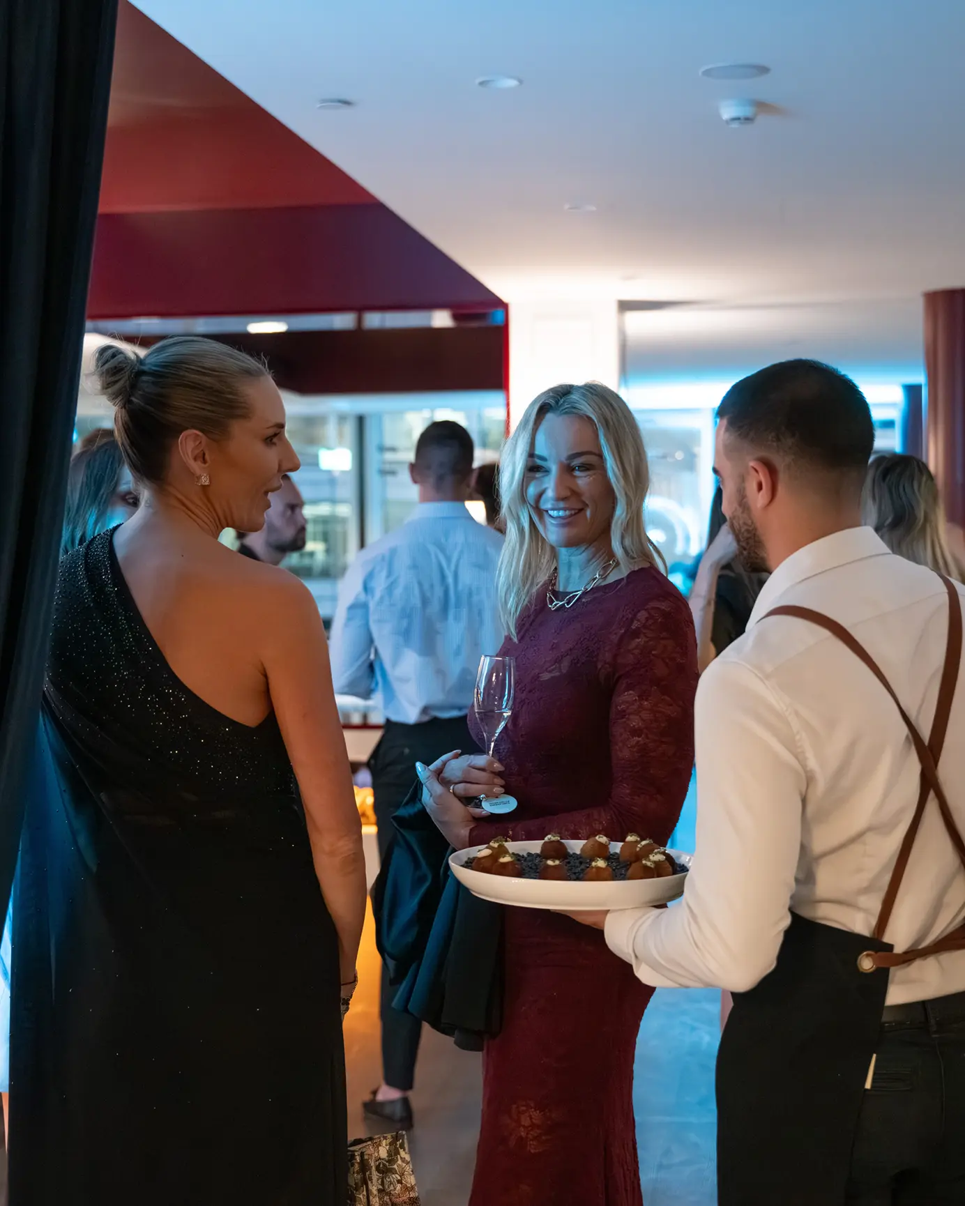 Guests enjoying canapés at a corporate networking event in North Sydney