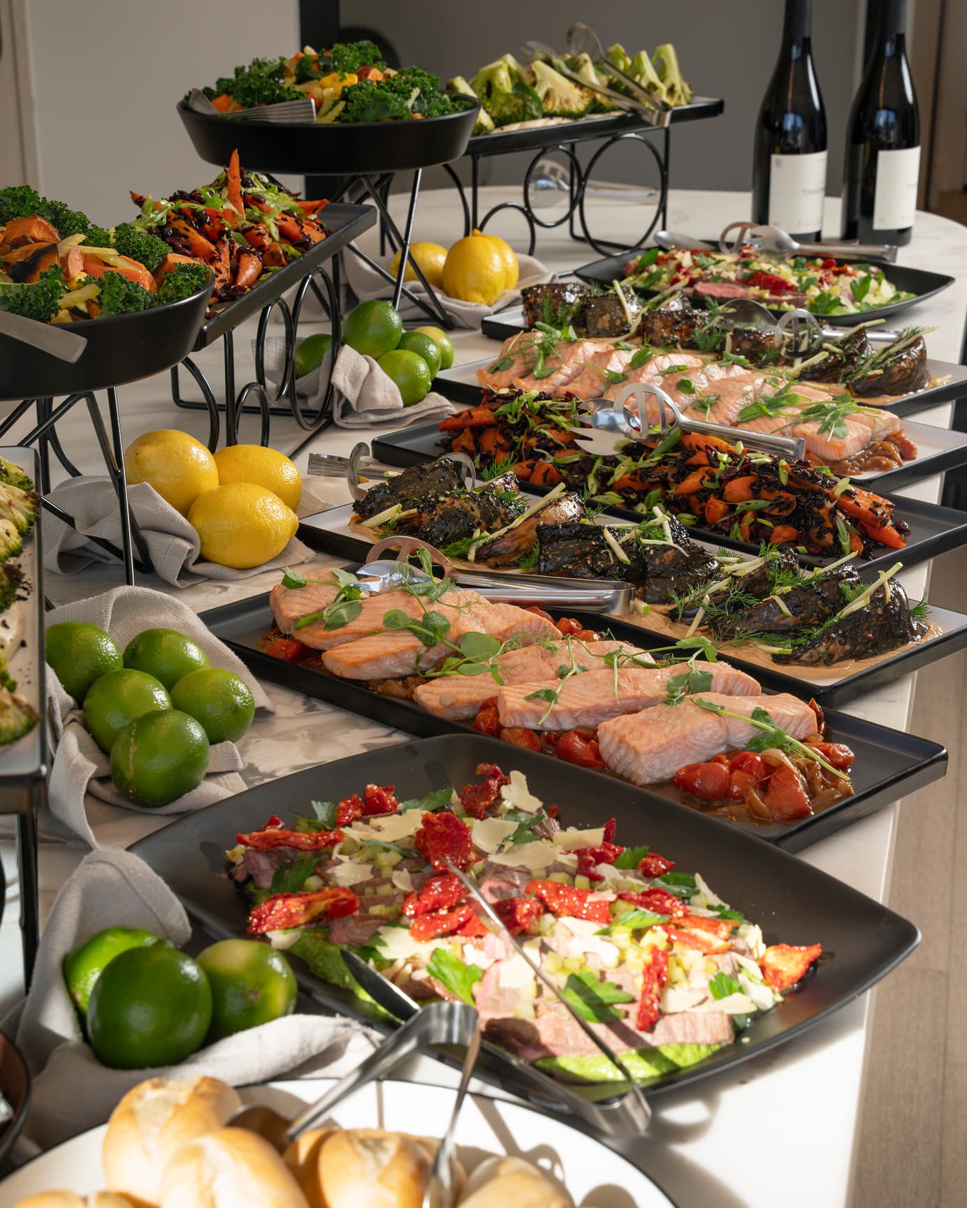 Styled buffet stations set up on a kitchen island for a Penrith party