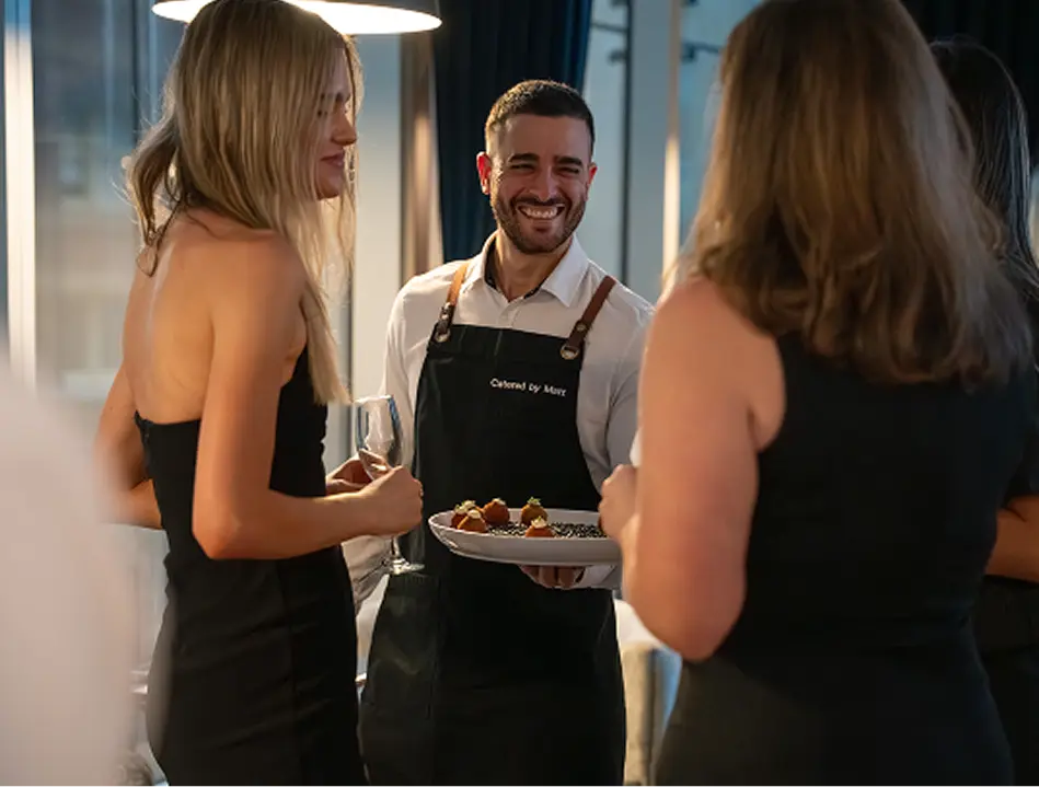 Waiter offering canapés to guests at a Parramatta 50th birthday party
