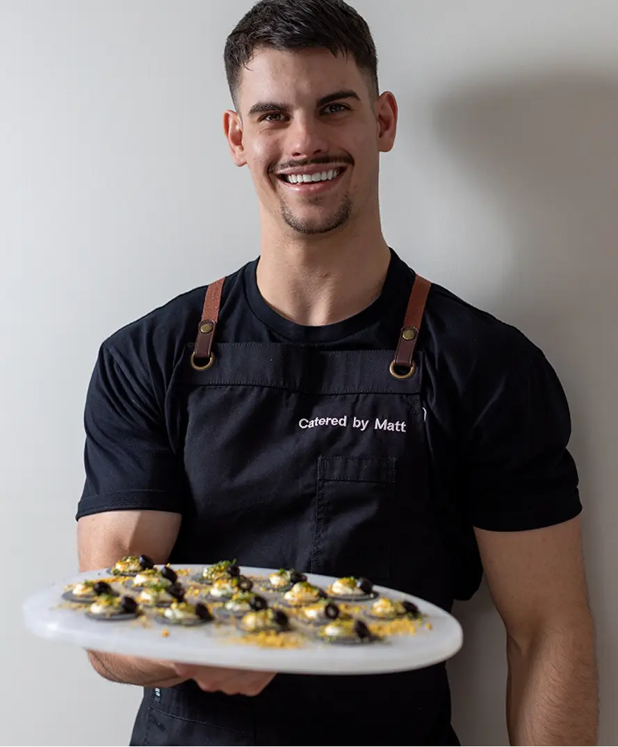 Founder, head chef Matt Mirosevich holding a platter of canapés