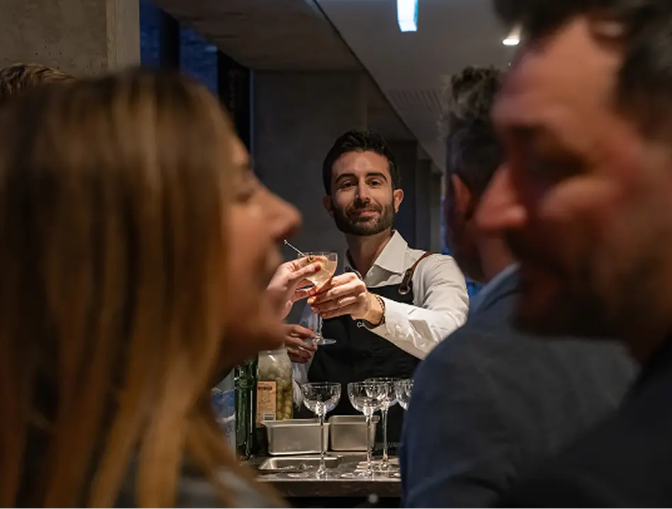 Bar staff serving cocktails at a Wollstonecraft home party