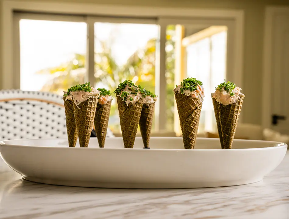 Savoury cones filled with salmon and chives, plated on a platter for a Sydney party