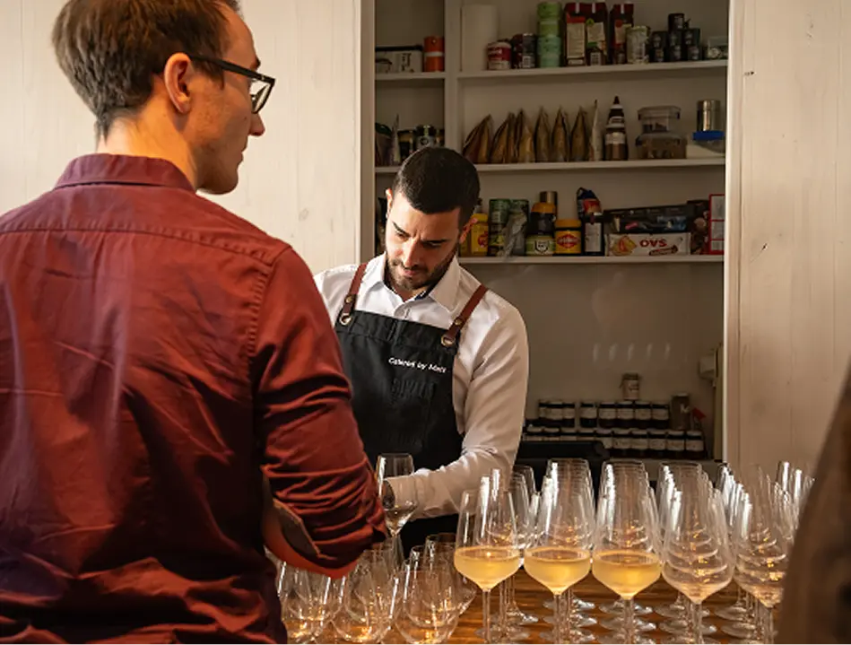 Catering staff pouring wine for guests at a fully managed Chatswood event