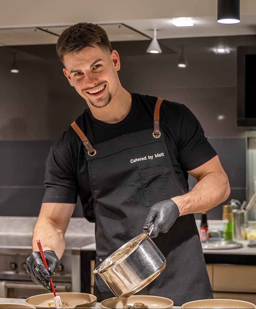 Chef Matt Mirosevich finishing plated courses in a Penrith kitchen