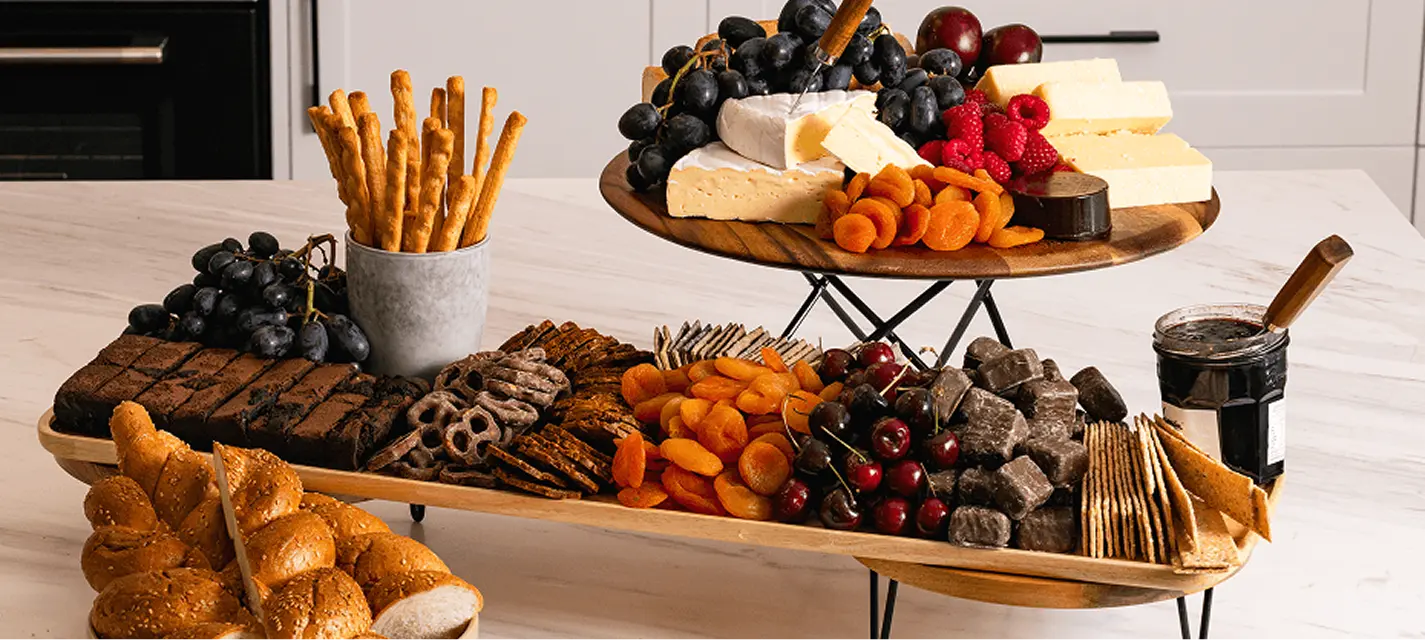 Grazing table of cheeses, dried fruits, crackers and breads for a Campbelltown event