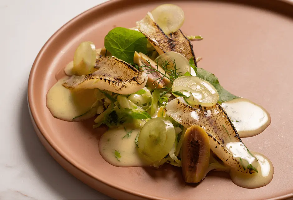 Plated grilled fish with fennel, grapes and nasturtium for a Mosman degustation