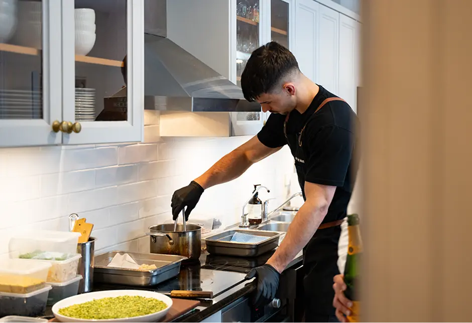 Chef cooking at the stove during service at a Sutherland Shire event