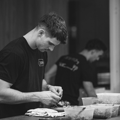 Chef Matt garnishing dish for corporate catering Sydney